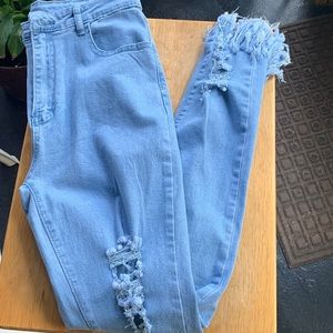 Distressed blue jeans.